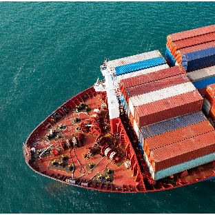 A custom aerial view of a container ship in the ocean with enhanced risk management.