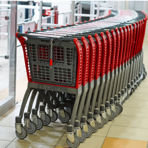 A row of shopping carts in a store, where the organized retail crime is prevalent.